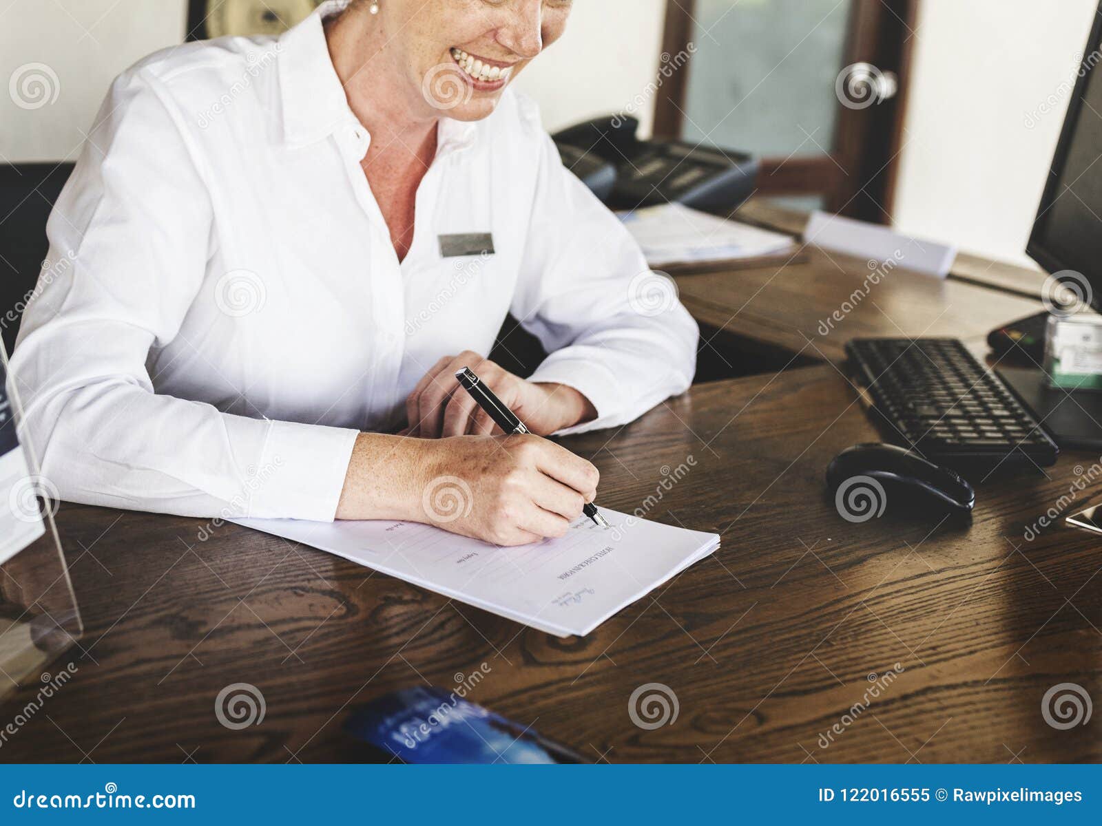 Receptionist Working At The Front Desk Stock Image Image Of