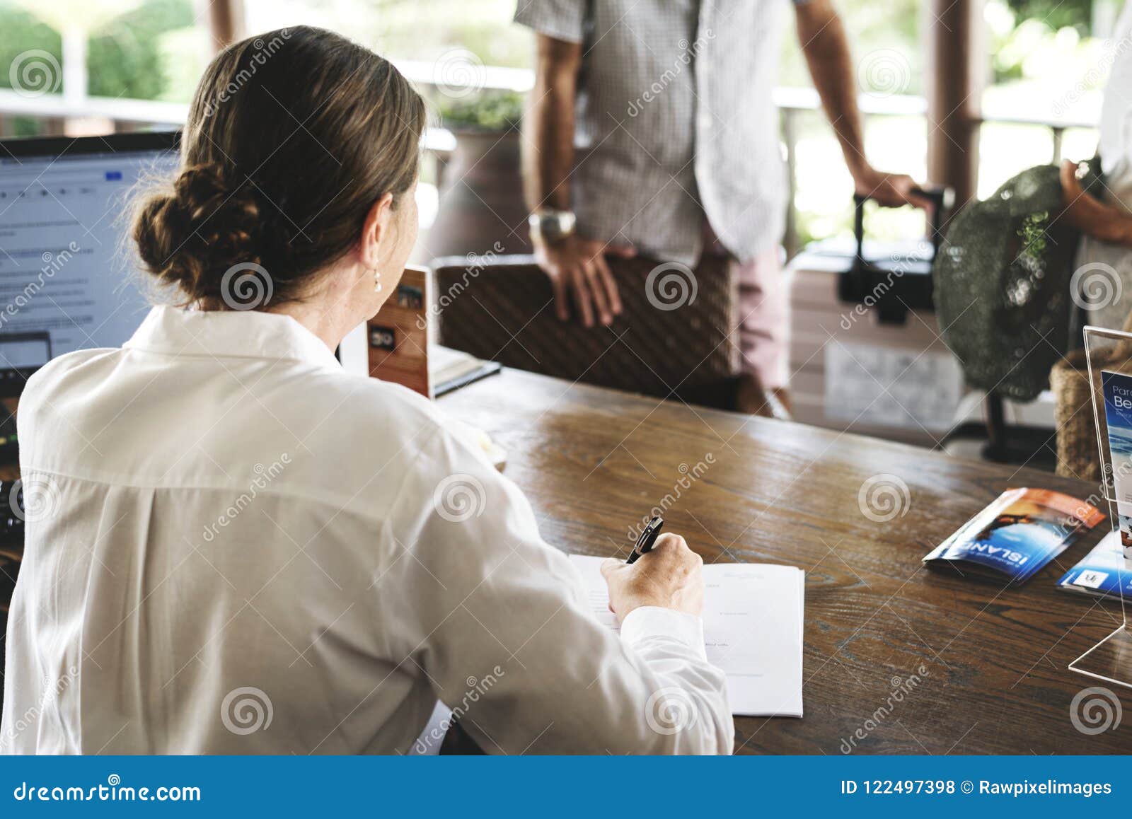 Receptionist Working At The Front Desk Stock Photo Image Of