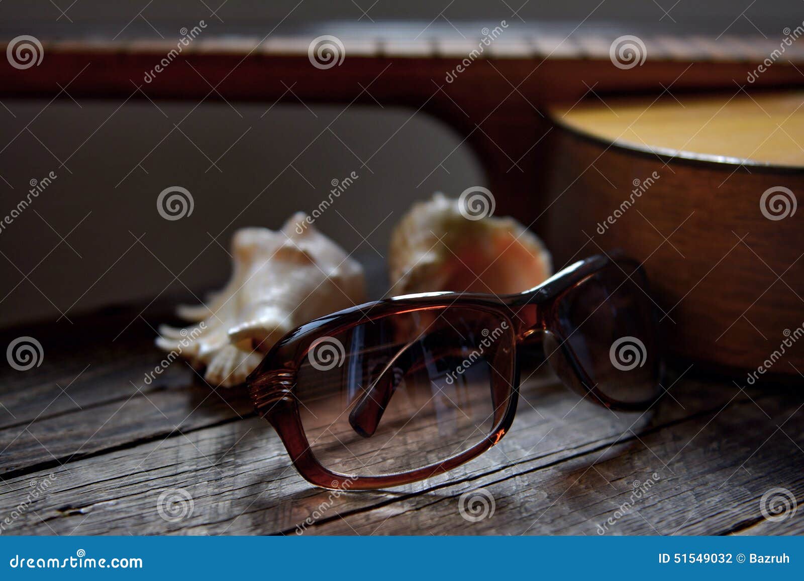 recollection of summer, guitar, sunglasses and shells from the sea
