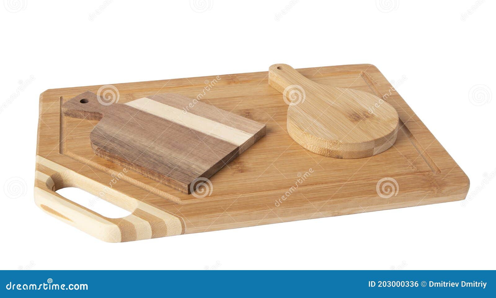 A Rectangular Bamboo Kitchen Cutting Board on it are Two Small Cutting Boards. Stock Photo