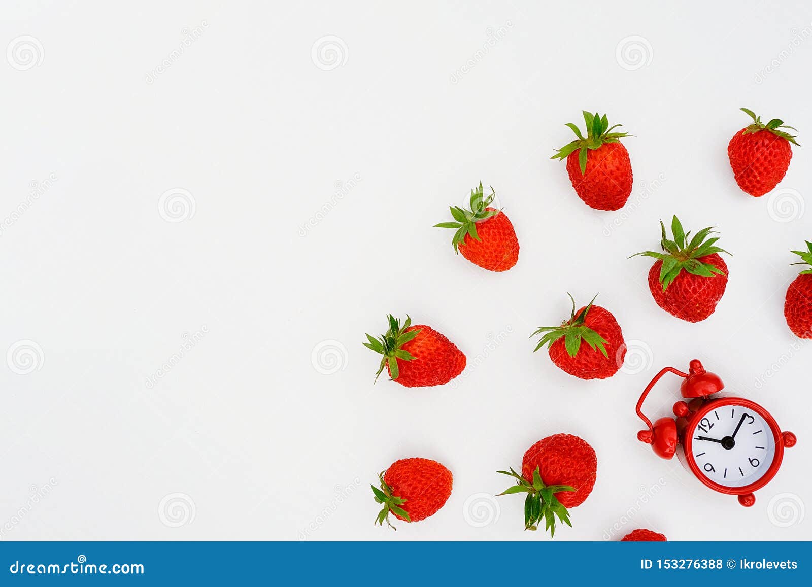 Red Alarm Clock and Flying Scattering Strawberries Berry on White ...