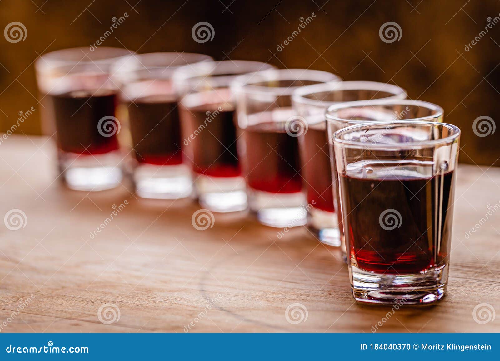 Red Alcohol Shots in Small Glasses on a Celebration Stock Photo Image