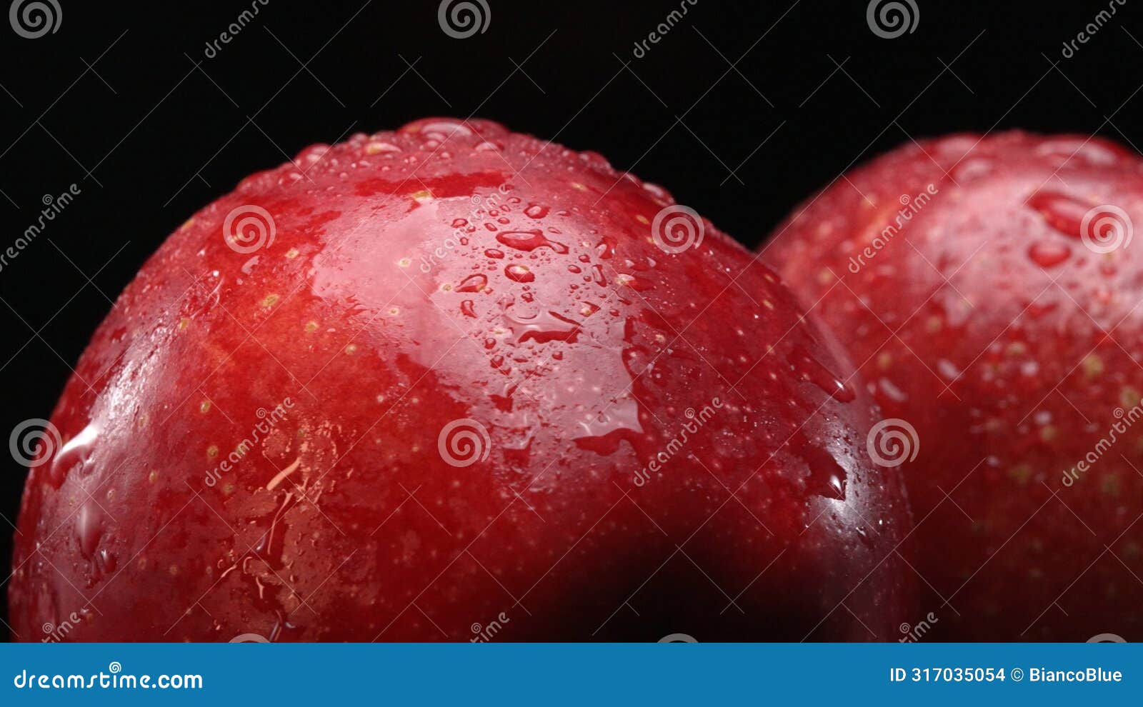 red apple with crisp white flesh with separated black background. comestible.