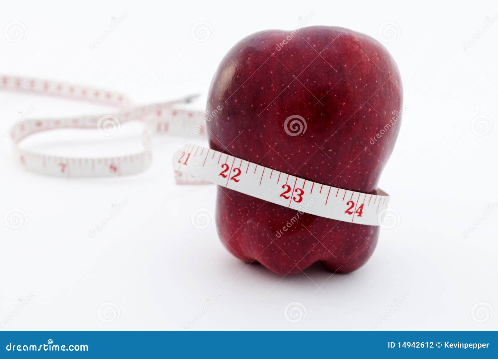 Red apple with tape measure around waist. Red apple on white background with tape measure, image of wight loss