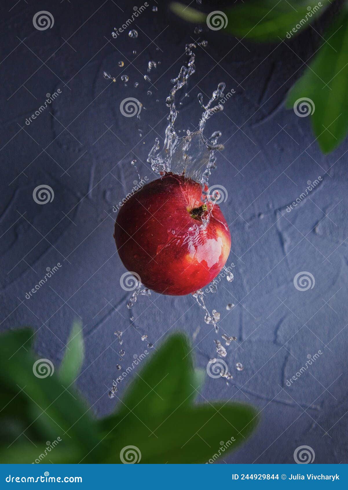 A Red Apple and Water Splash. Fruit and Water Stock Photo Image of