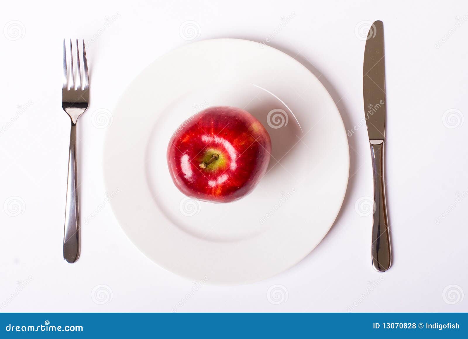 Red apple on white plate stock photo. Image of restaurant - 13070828