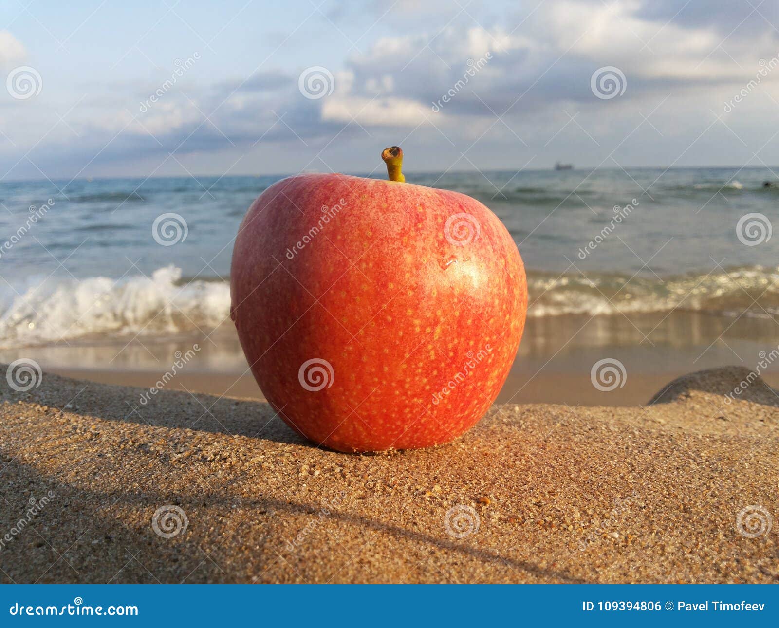 Red Apple on Yellow Sea Sand Stock Photo - Image of blue, sand: 109394806