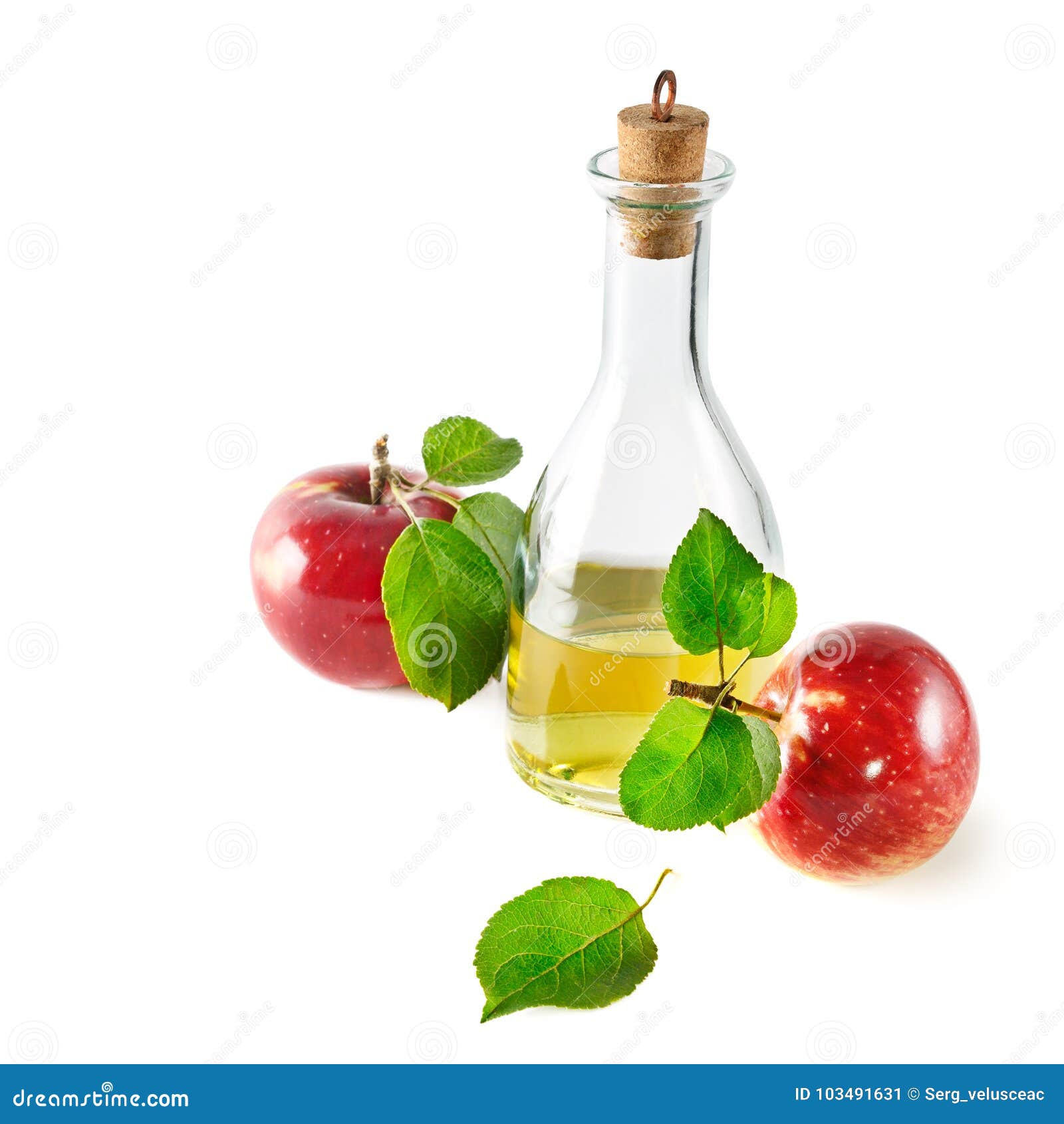 red apples and apple cider vinegar  on white.