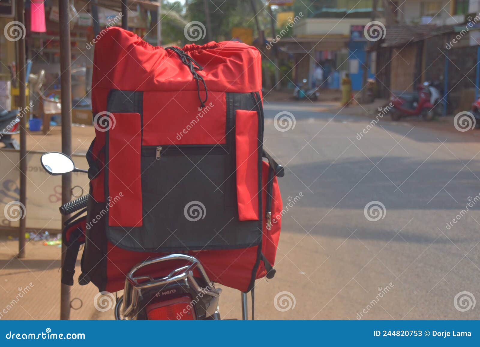 Red Bag of Online Delivery Boy Somewhere in the GOA INDIA. Stock Image