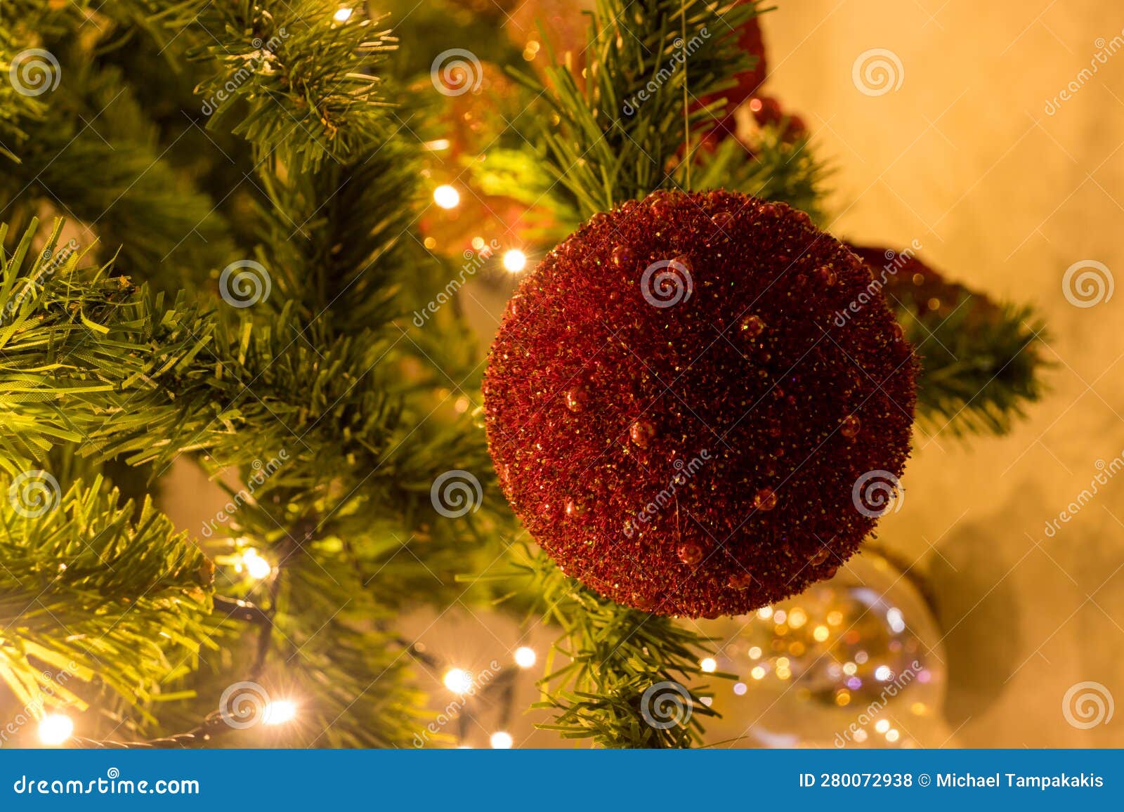 A Red Ball Ornament on a Christmas Tree Stock Photo Image of blurred