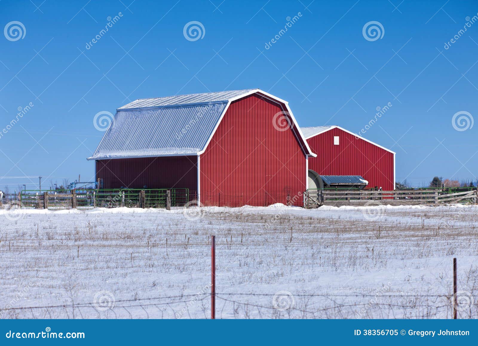 red barn on snowy prairie.