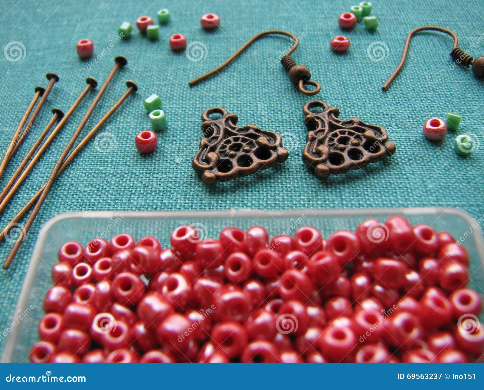 Red Beads And Pieces For Making Earrings Handmade Jewelry Stock - Red Beads And Pieces For Making Earrings Handmade Jewelry Stock Photo red beads and pieces for making earrings handmade jewelry stock - red beads and pieces for making earrings handmade jewelry stock photo