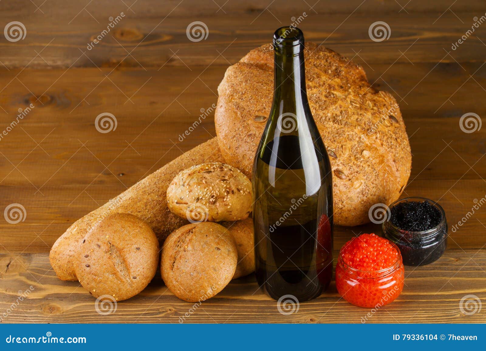 Red, Black Caviar, White Wine and Bread on the Table Stock Photo