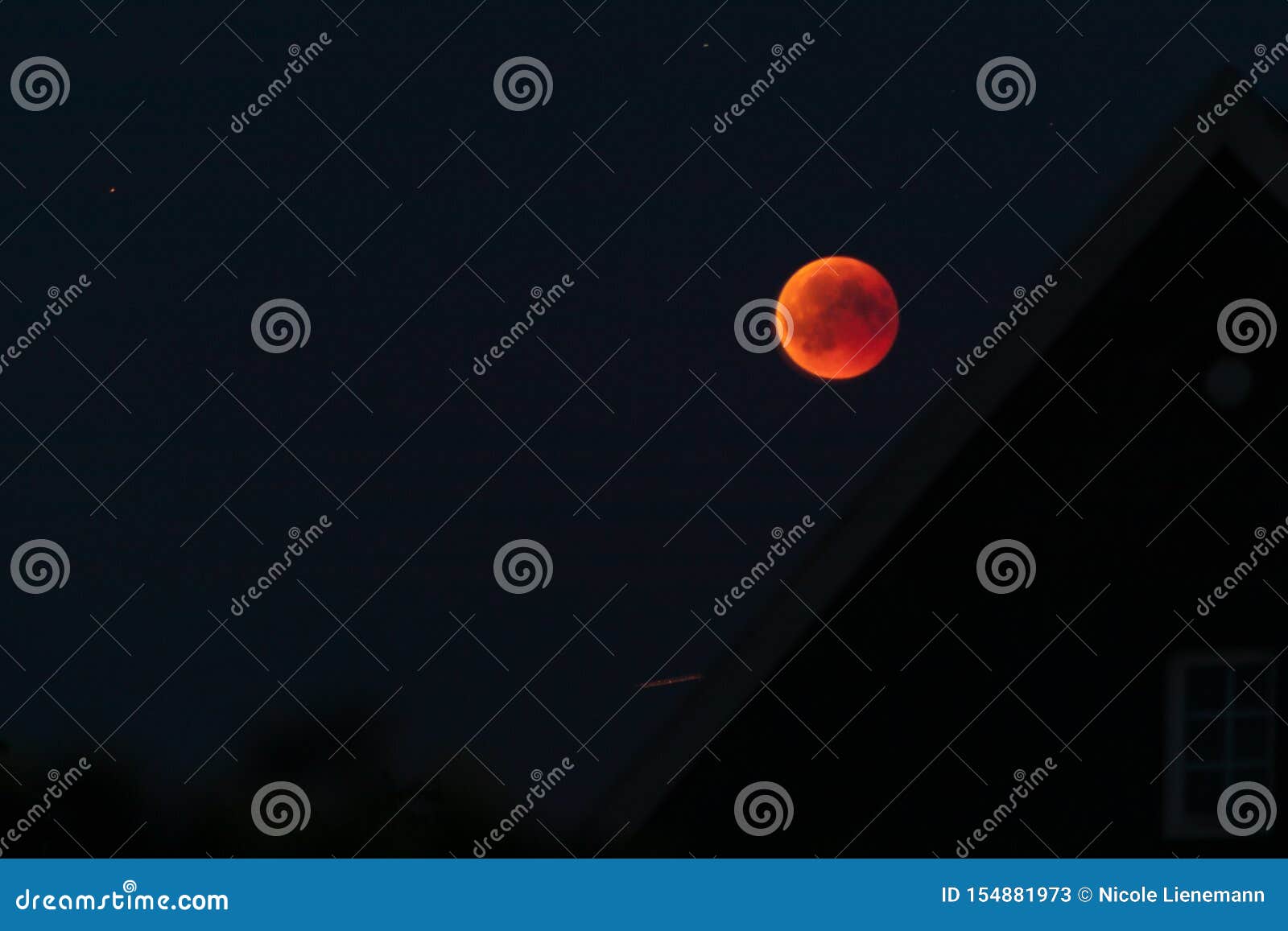 red blood moon in the darkness of night lunar elipse