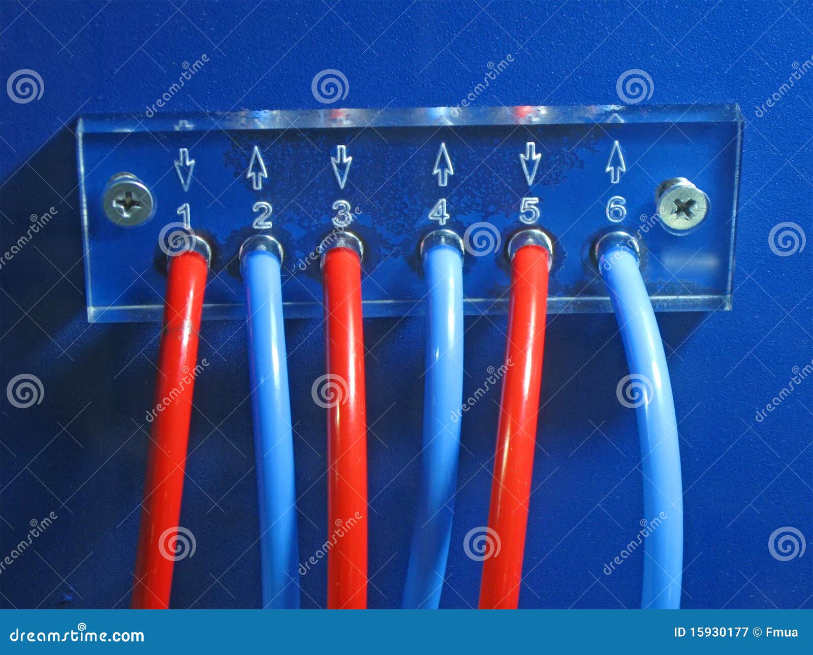 Red, Blue Connected Cables Pack on Blue Control Panel Surface Fixed