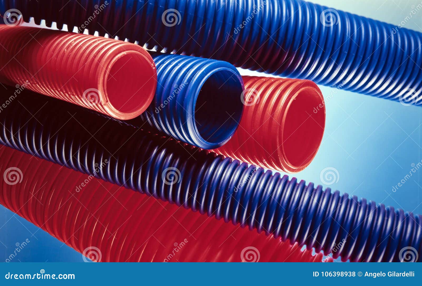 Red and blue plastic tubes stock photo. Image of color 106398938