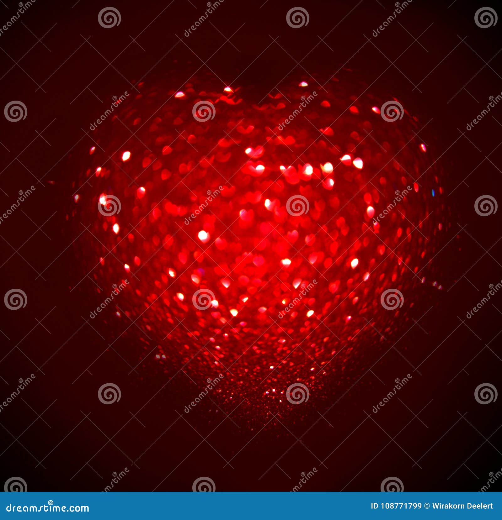 red blur heart  of ligth bokeh on a black background