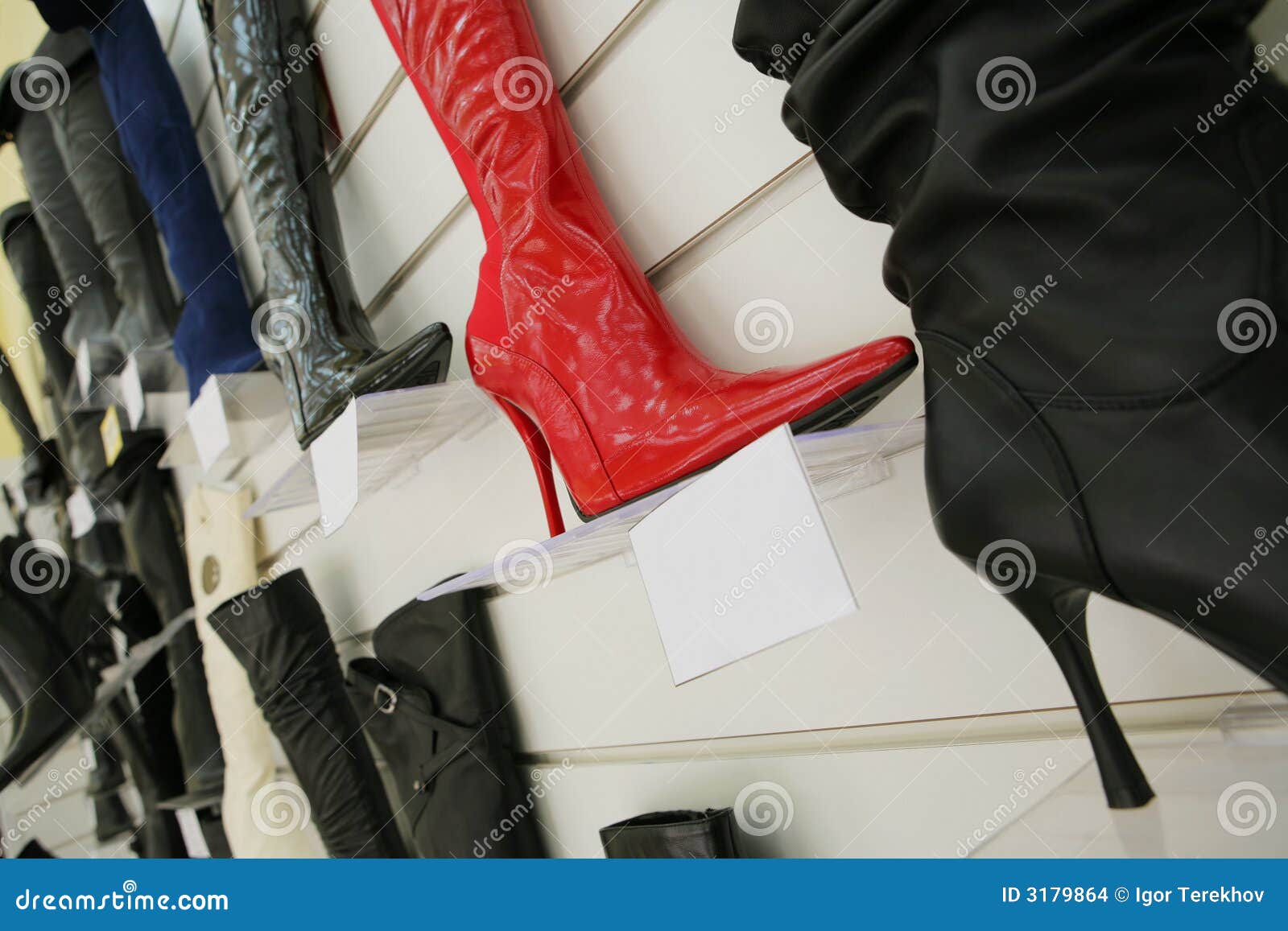 Red boot on a high heel in shoe shop