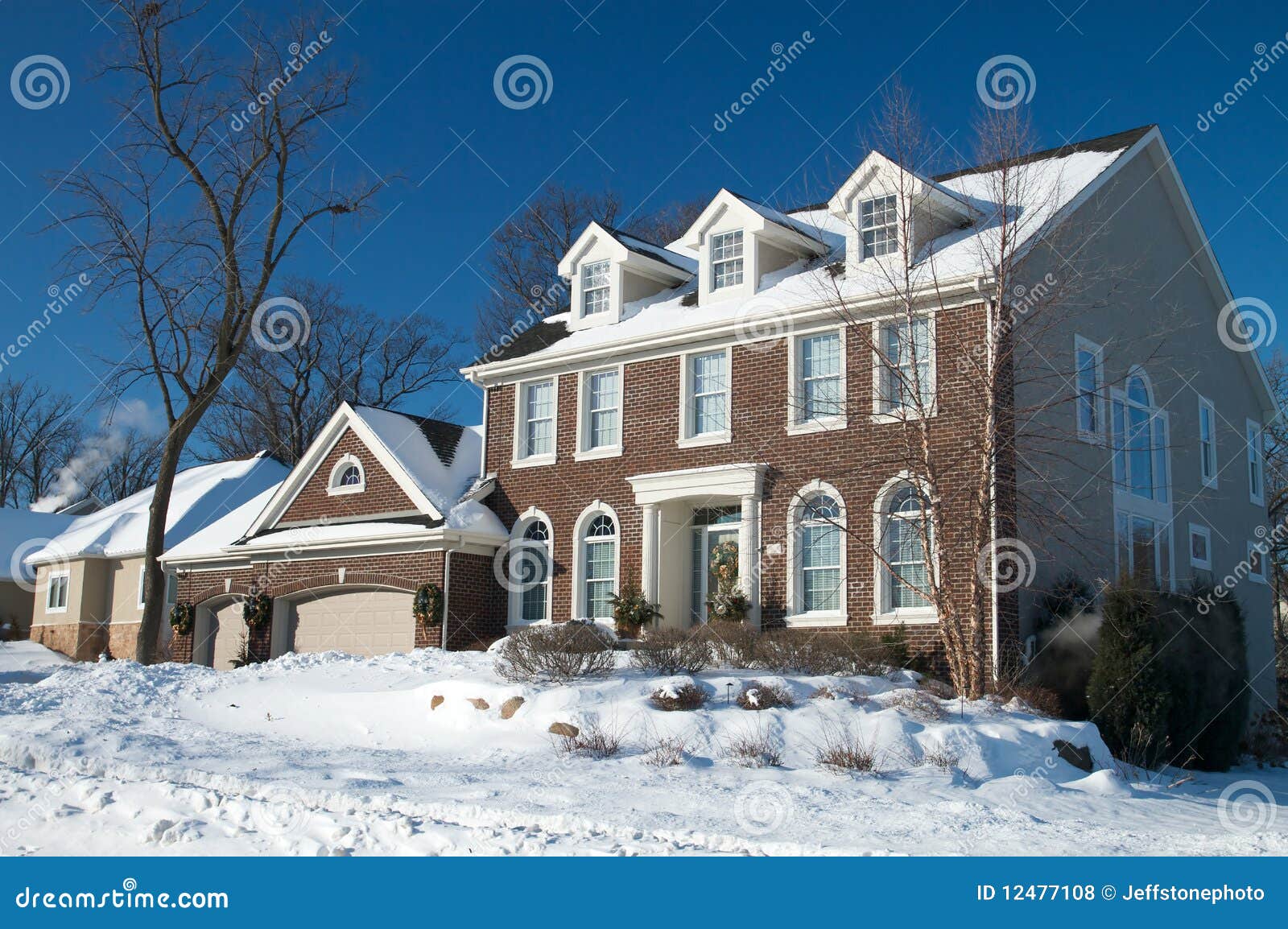 Red Brick Colonial Home In The Winter Snow Royalty Free 