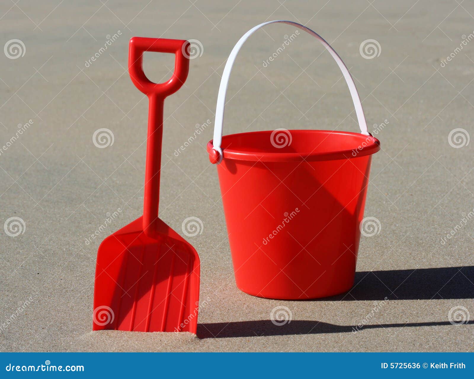 red bucket and spade