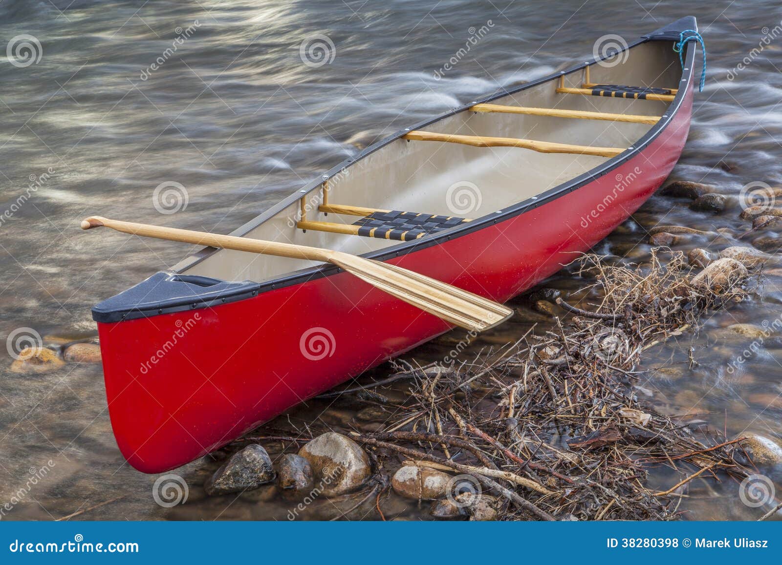 Red Canoe With A Paddle Royalty Free Stock Photos - Image 