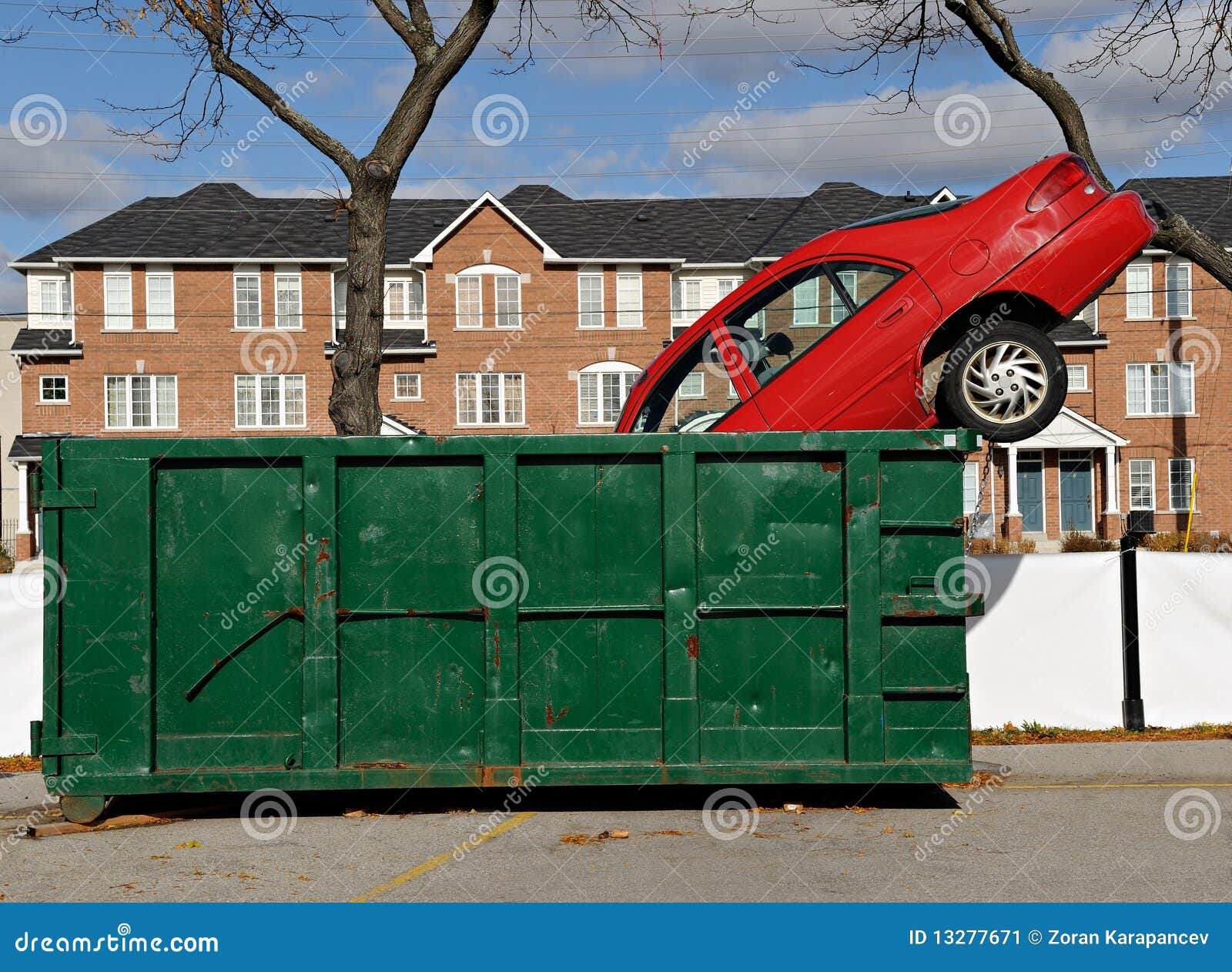 Red car and green dumpster stock image. Image of automobile 13277671