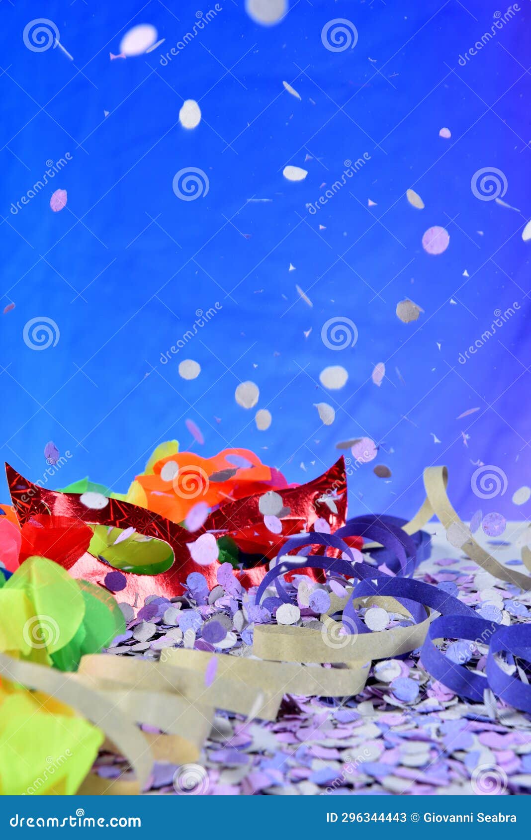 red carnival costume mask with colorful confetti and streamers joyful brazilian party celebration on white background with space
