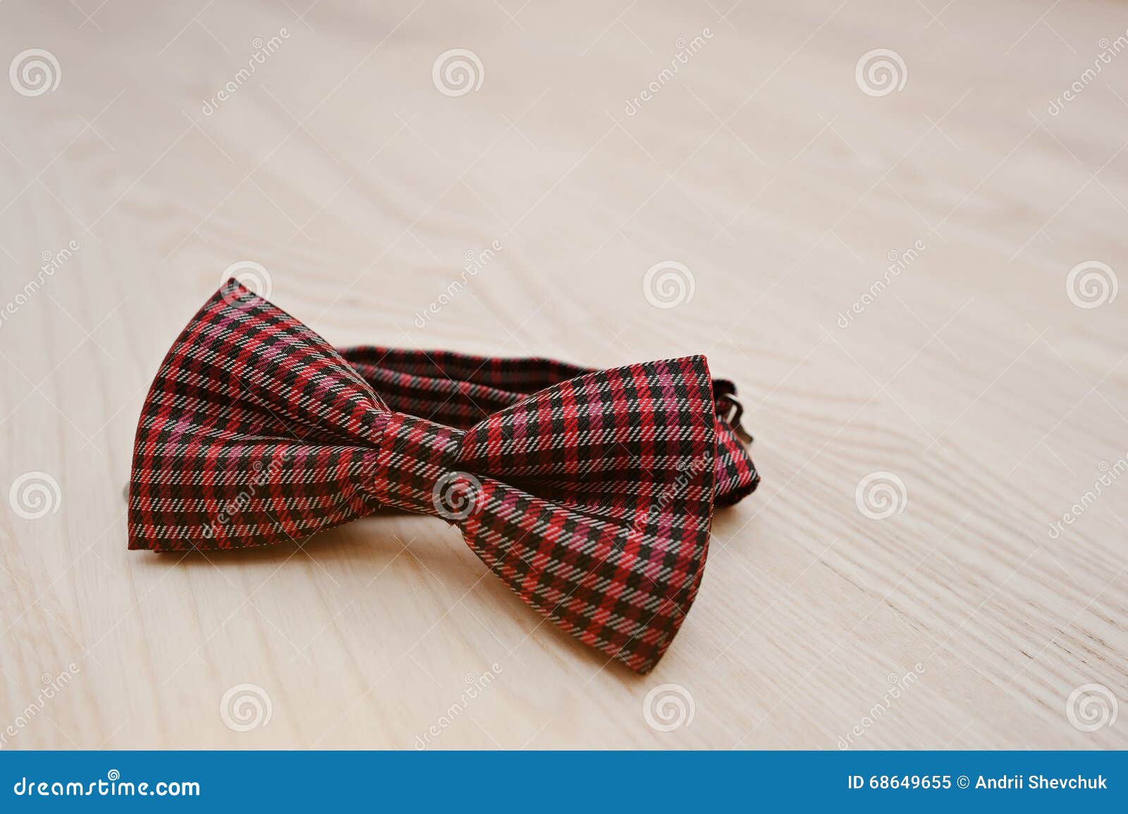 Red Checkered Bow Tie on Light Wooden Background Stock Image - Image of ...