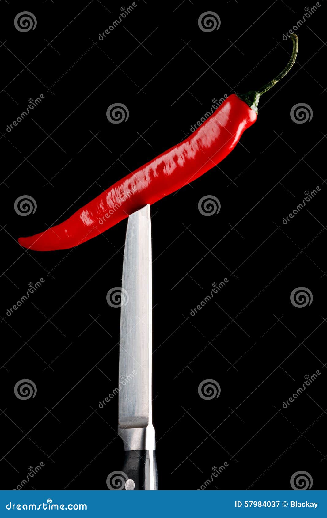 Red chili pepper and knife stock image. Image of steel 57984037