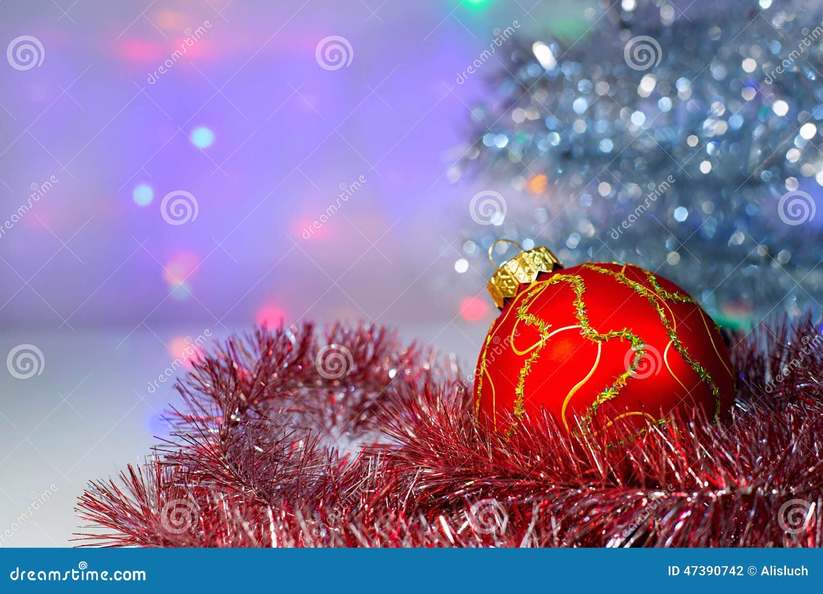 Red Christmas Ball Under the Tree and Tinsel Stock Photo - Image of ...