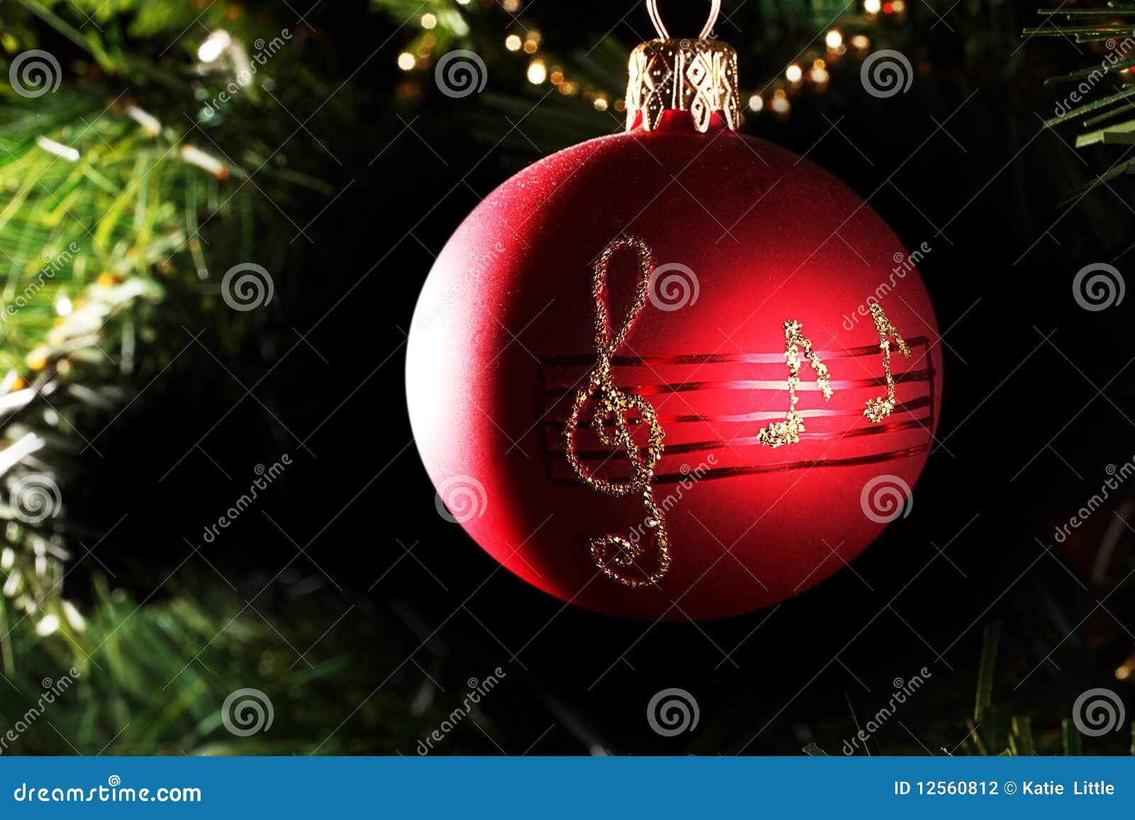 A Red Christmas Bauble With Musical Notes Stock 
