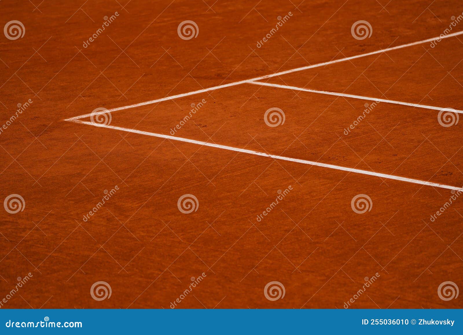 red clay tennis court ready for play