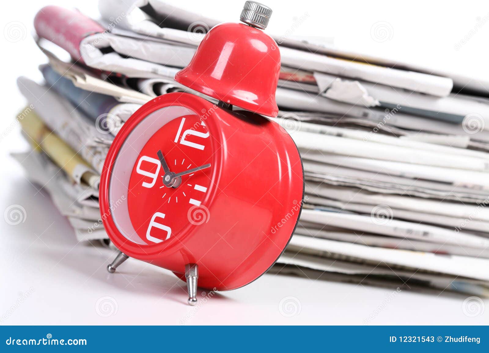 Red clock and newspaper stock image. Image of business 12321543