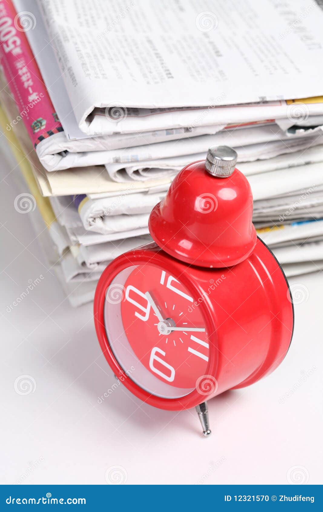 Red clock and newspaper stock photo. Image of isolated 12321570