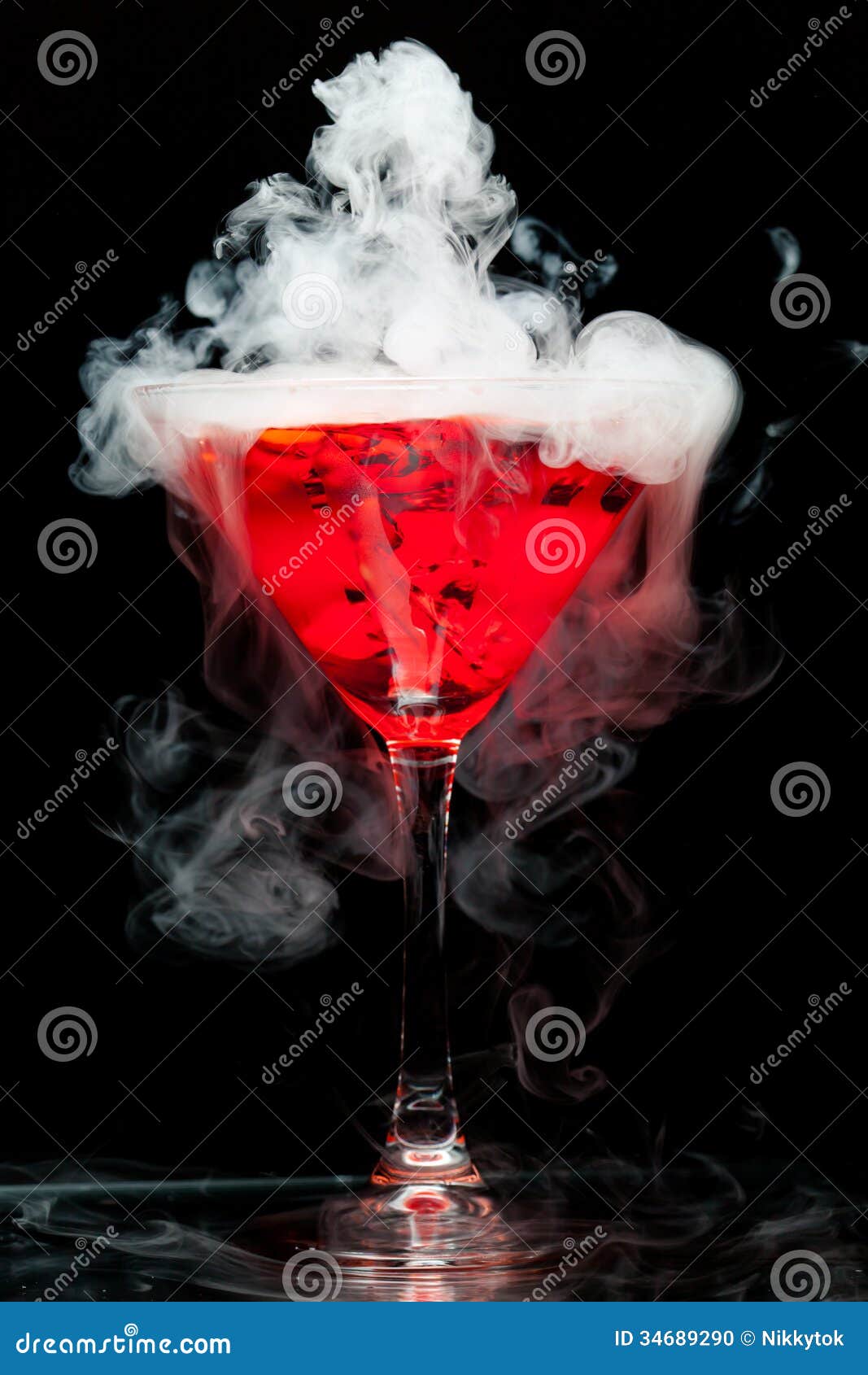 red cocktail with ice vapor