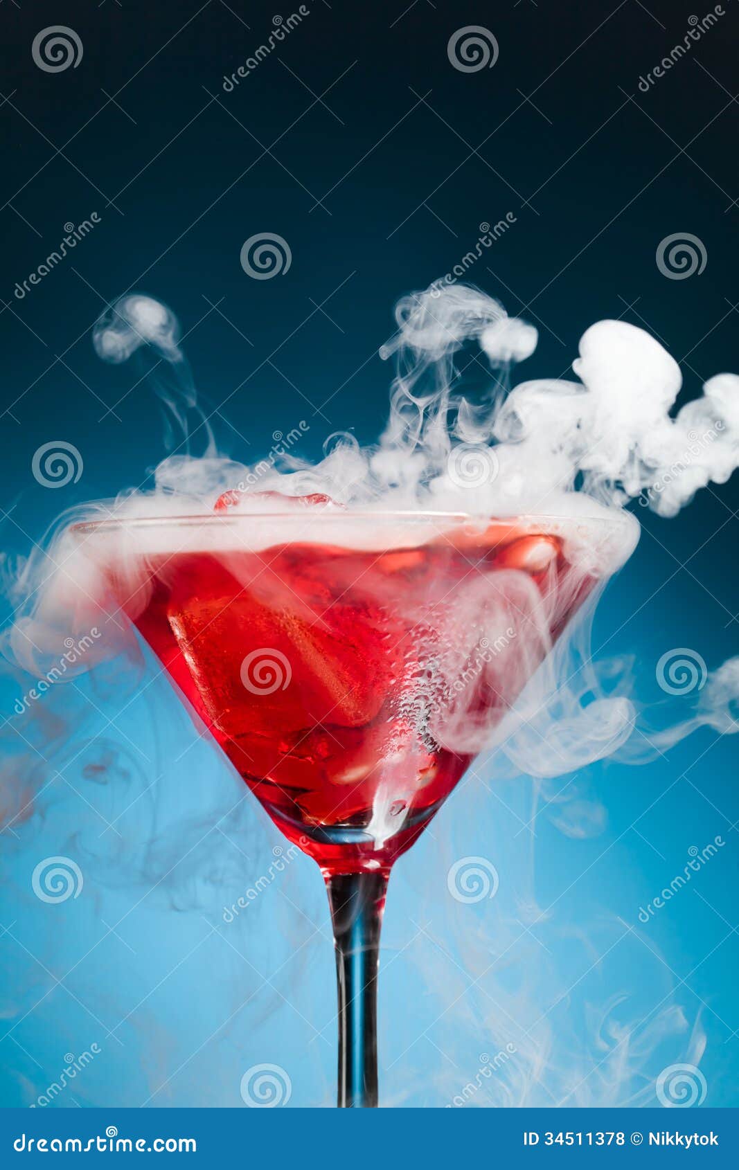 red cocktail with ice vapor