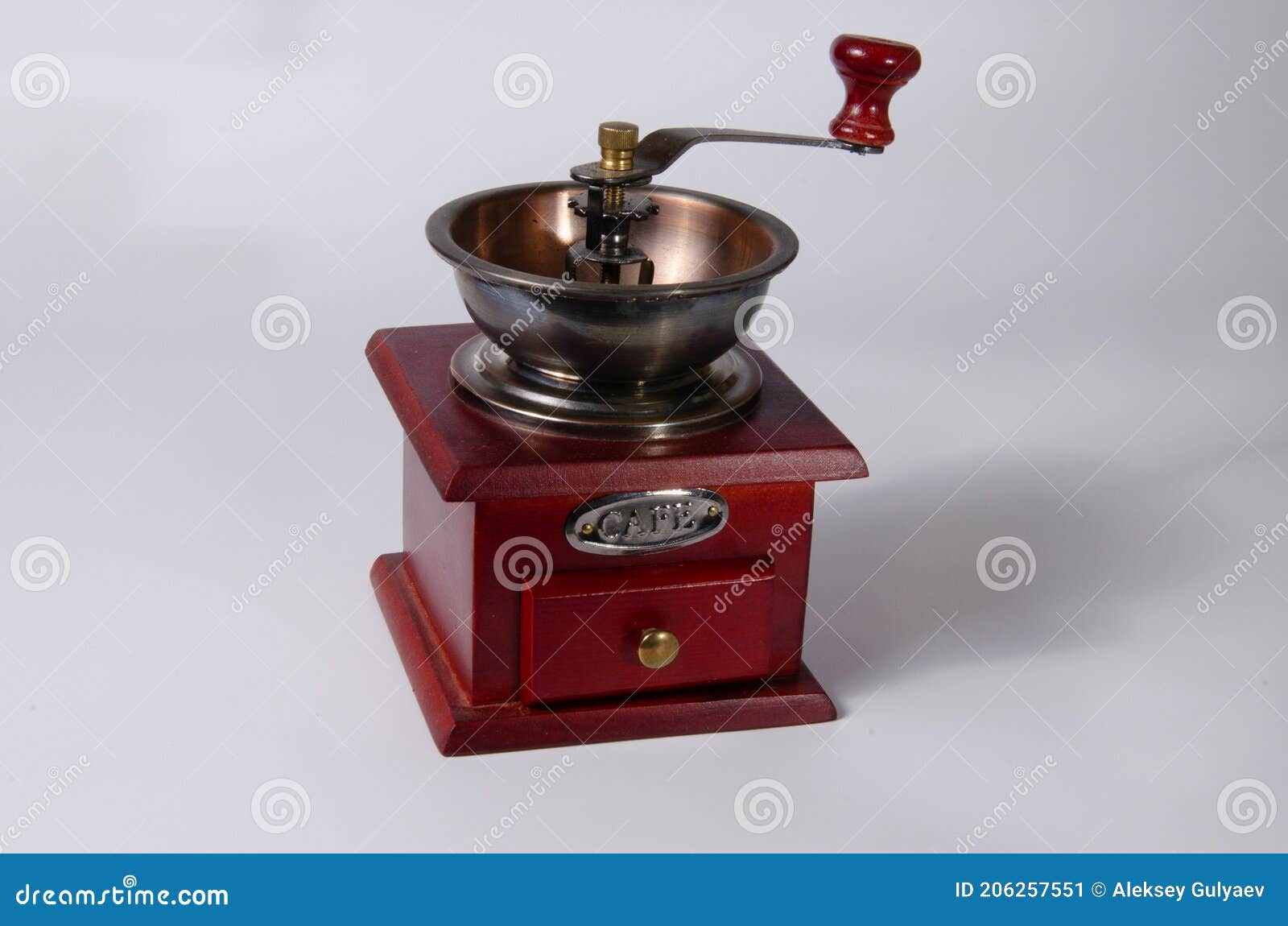 Red Coffee Grinder in Vintage Style on a White Background Stock Image