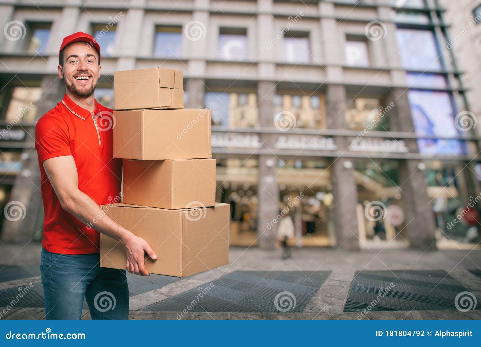 Red Courier Outside Carries Parcels for Deliveries of Shipments. Stock ...