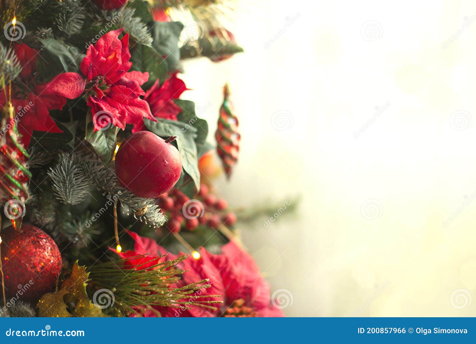 Red Decor on a Christmas Tree Made of Apples and Poinsettias. Christmas ...