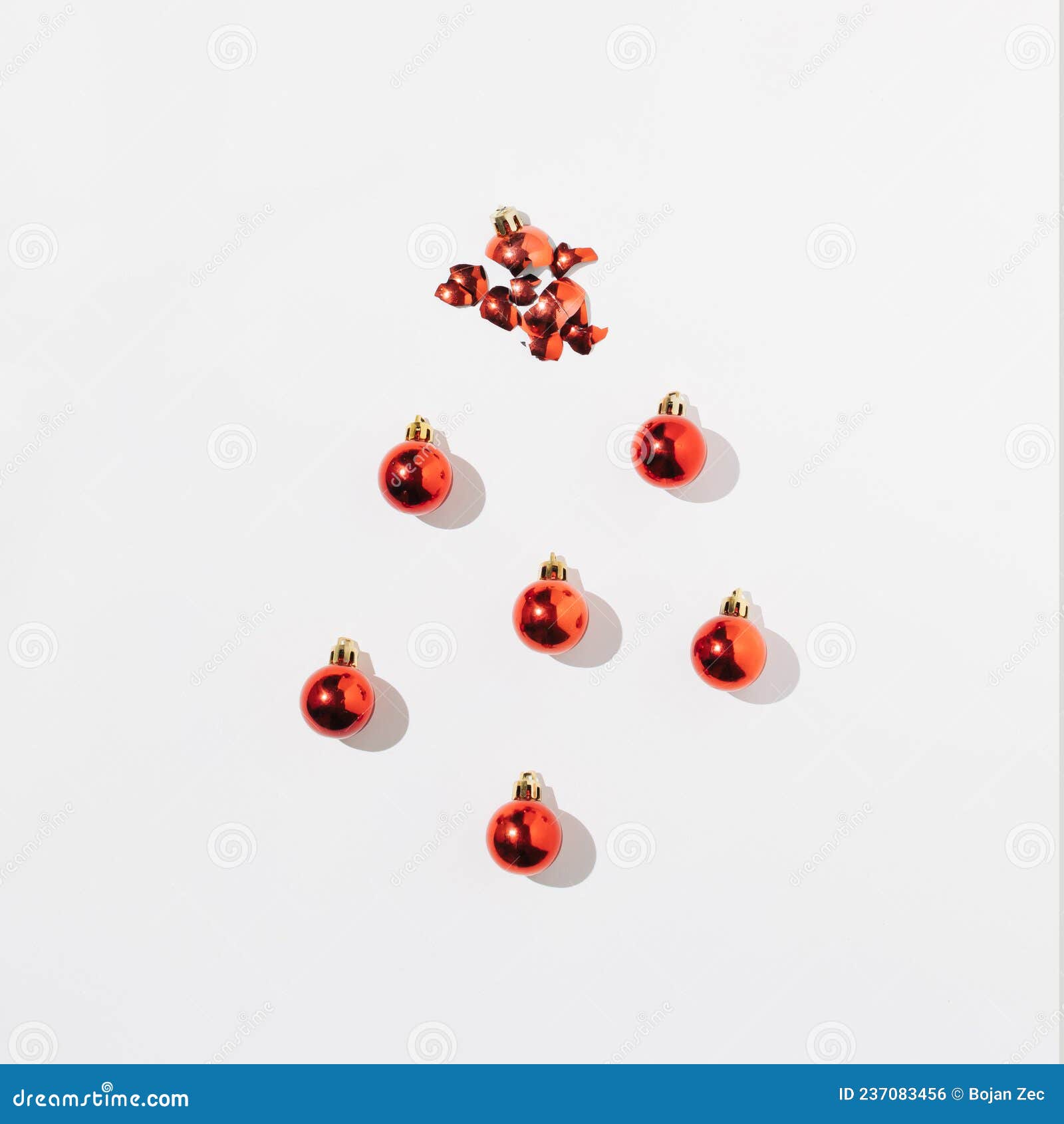 red decoracion balls with shadow on white background. top view. flat lay