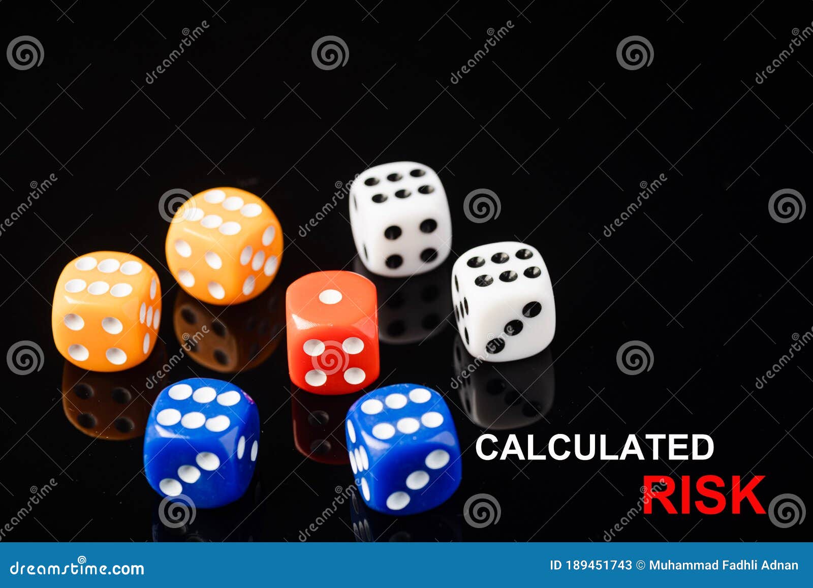 Red Dices Surrounded by Blue, Orange and White Dices Stock Image ...