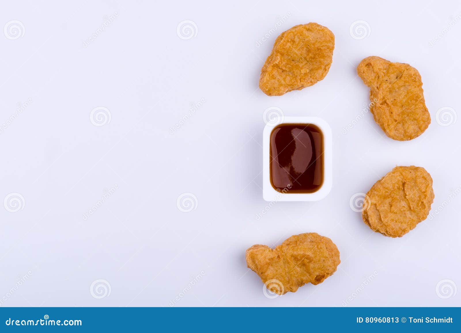 Red Dip Sauce in Plastic Container Surrounded by Four Chicken Nu Stock Image Image of group