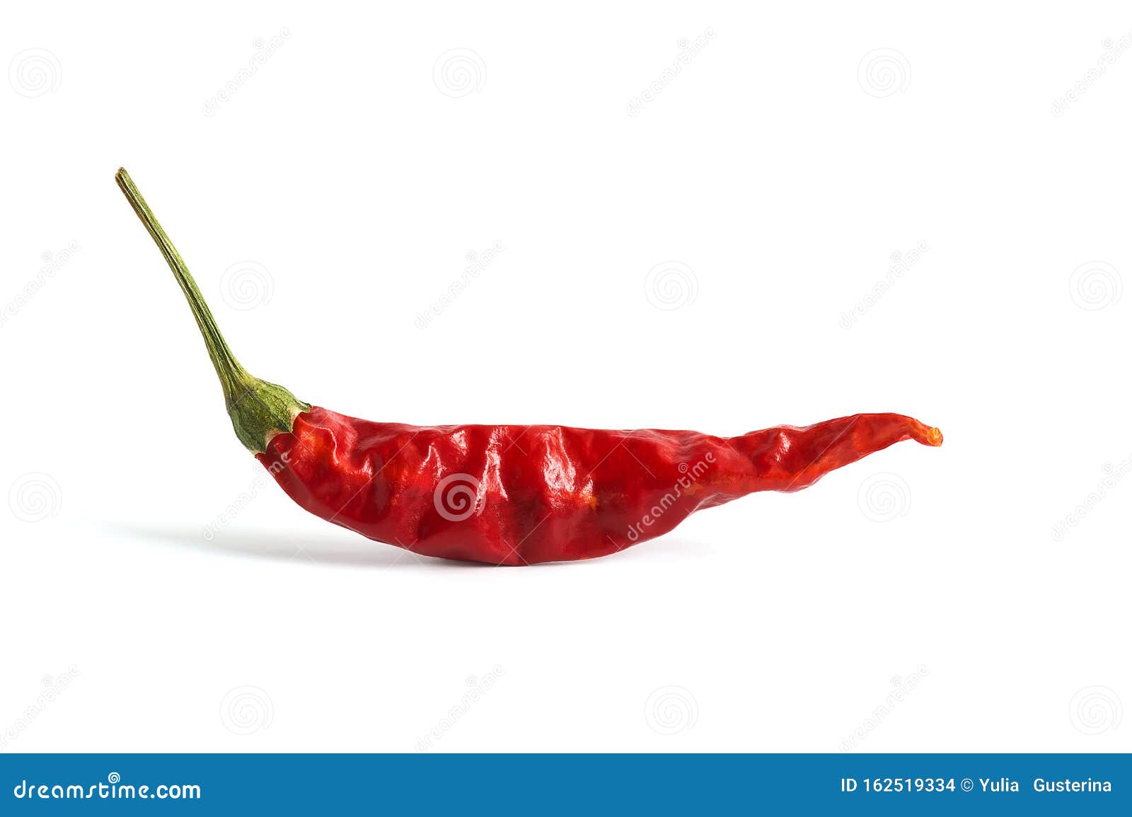 red dried chili peppers on a white background . hot pepper