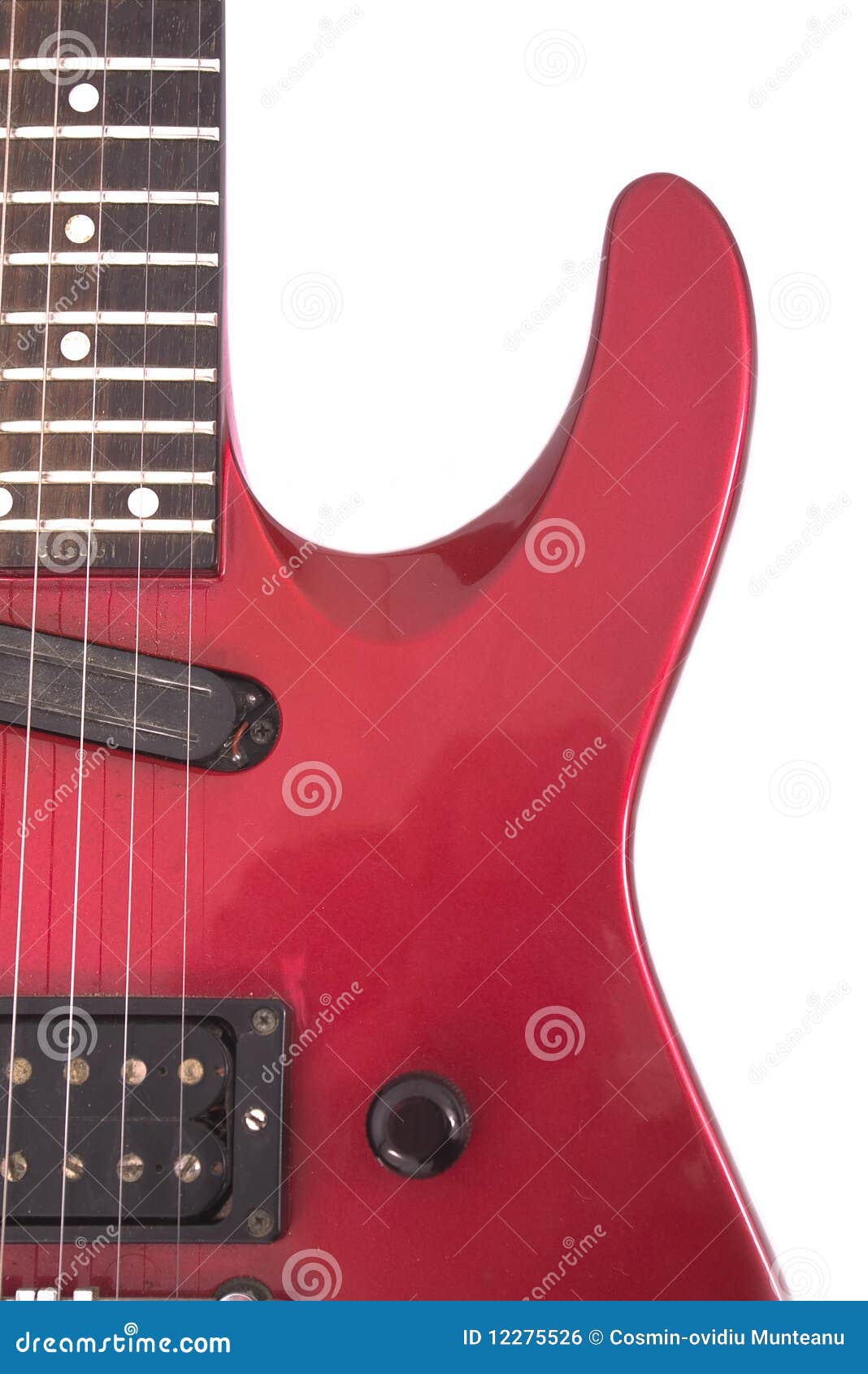 Red electric guitar on white background. A red electric guitar isolated on white background