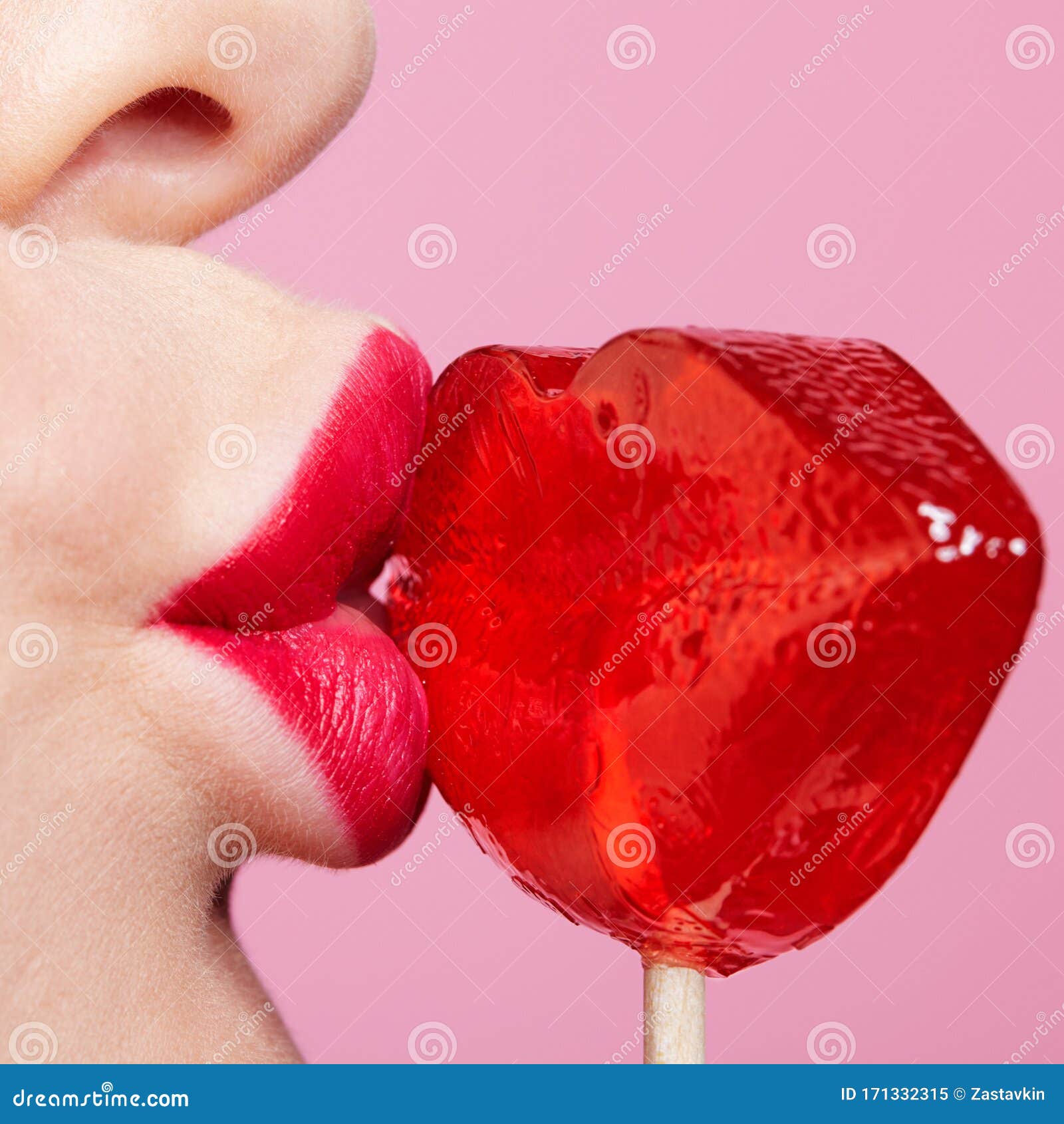 red female lips  lollipop. close-up of woman lips kissing candy. sweet tooth concept