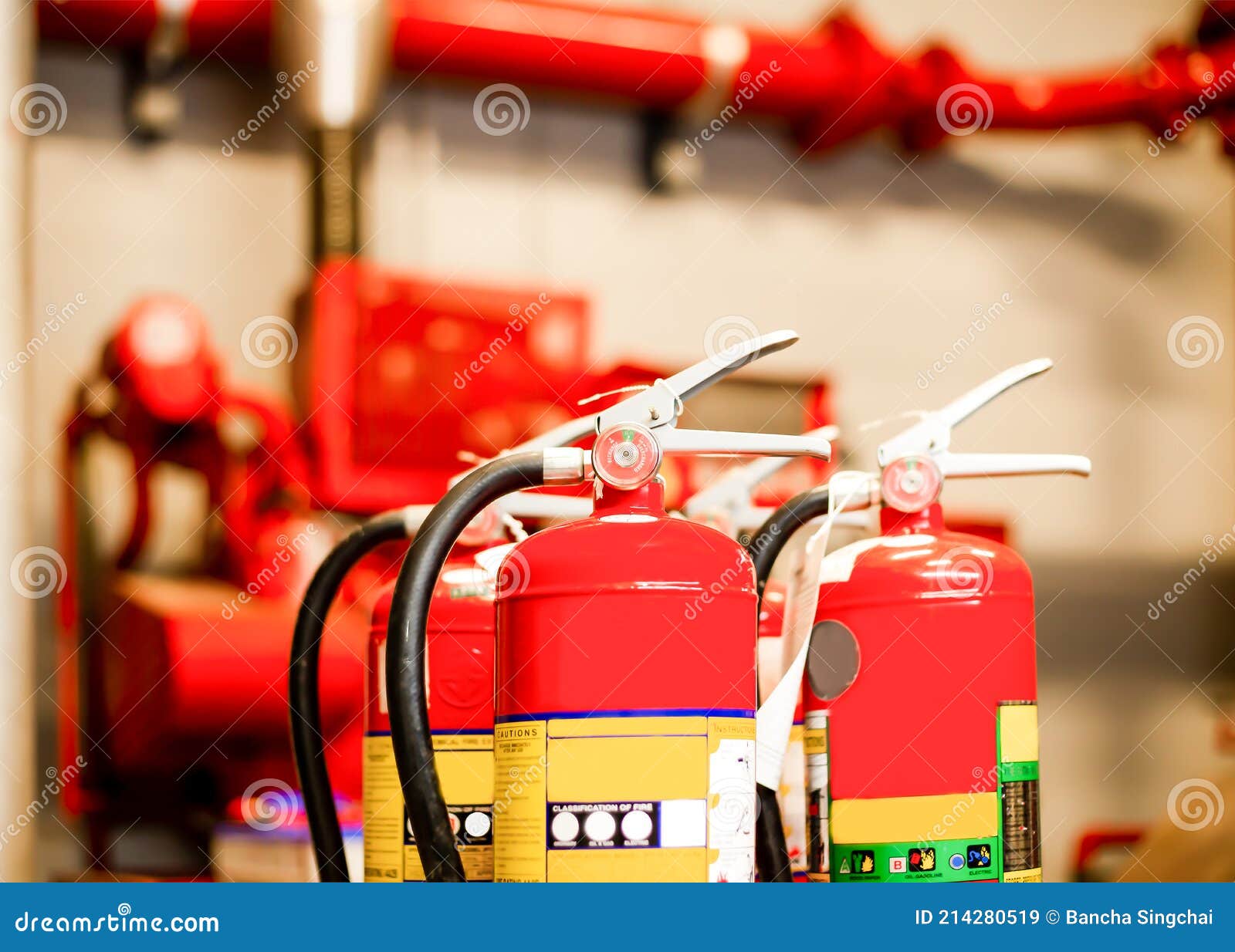 The Red Fire Extinguisher is Ready for Use in Case of an Indoor Fire