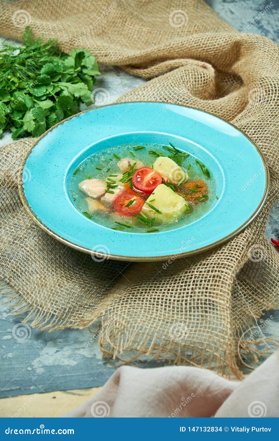 Red Fish Soup In A Blue Plate. Beautiful Serving Dishes