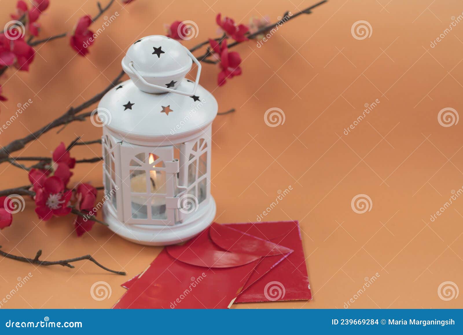 white lantern light with red flowers branch and red envelopes on orange background.