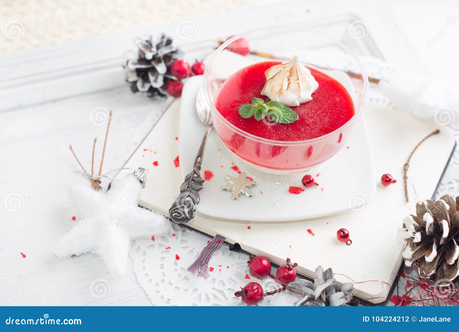 red fruit panacotta with green mint leaves