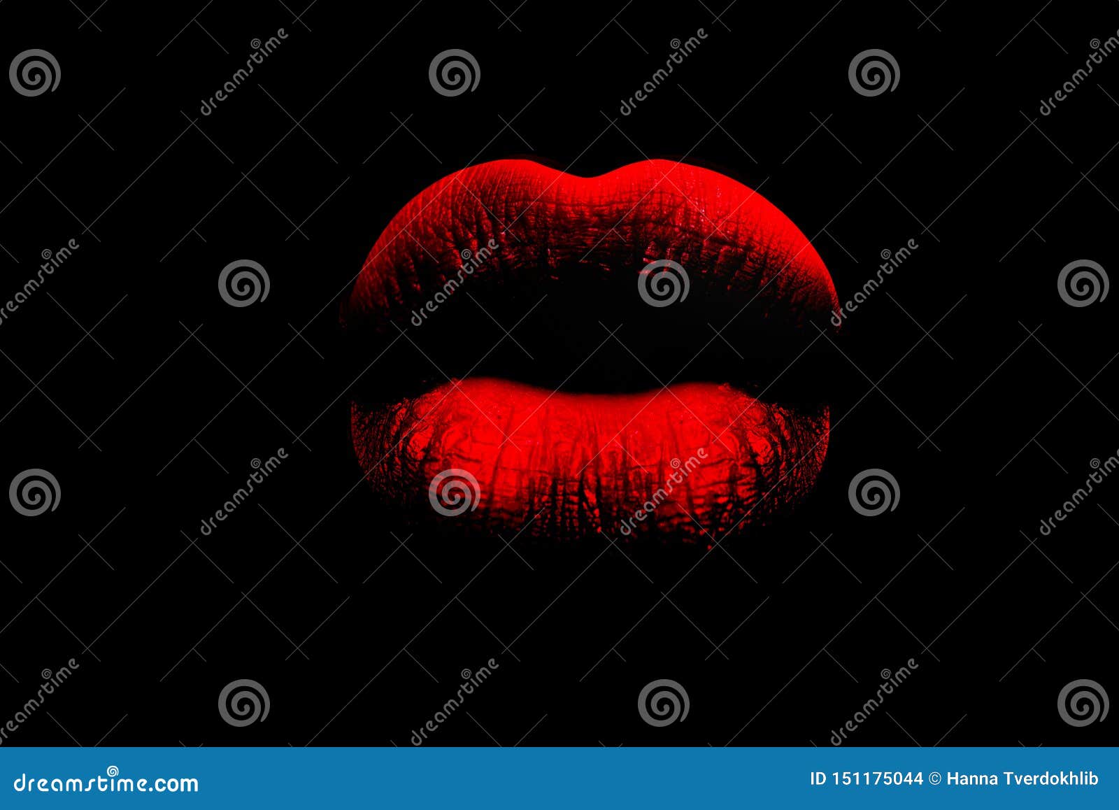 red full lips on black background. the woman`s lips. lush lips like a kiss. red and pouting. erotica, sex, temptation.